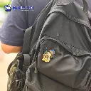 rain enamel pin on bag.webp